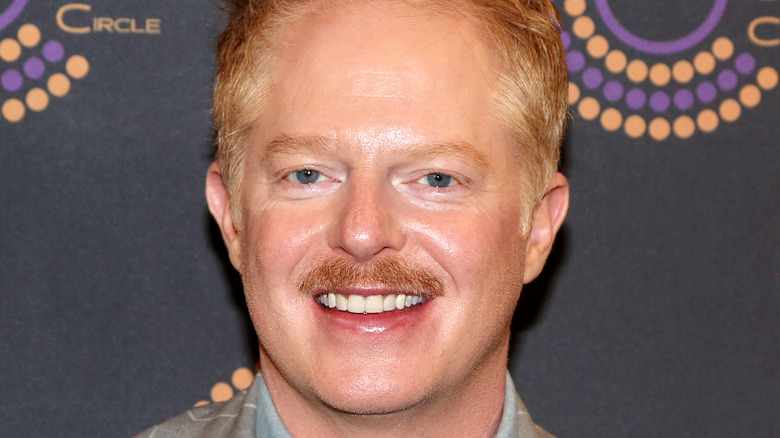 Jesse Tyler Ferguson smiling at event