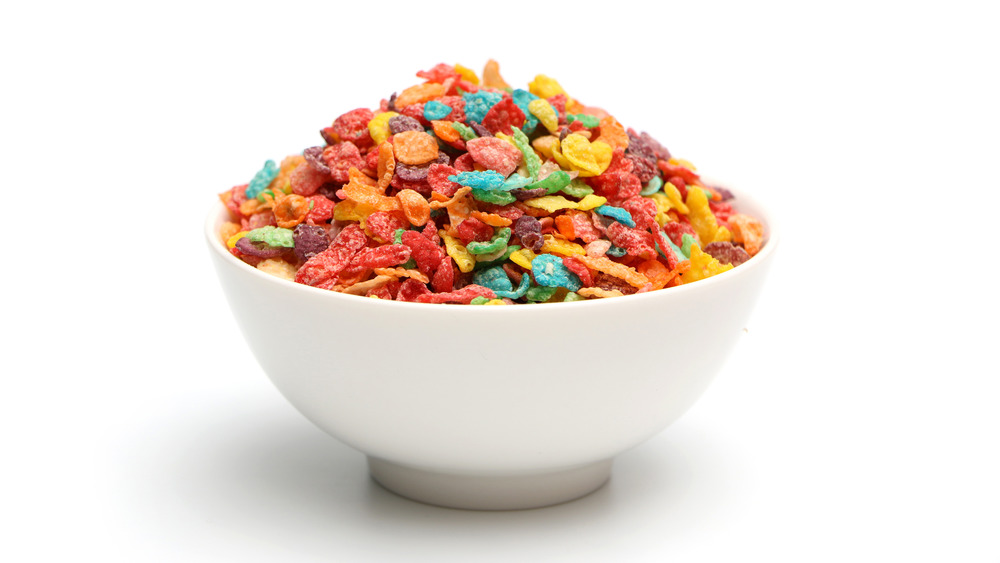 Fruity Pebbles breakfast cereal white bowl white background