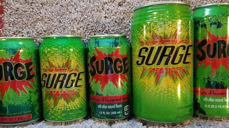 Cans of SURGE soda