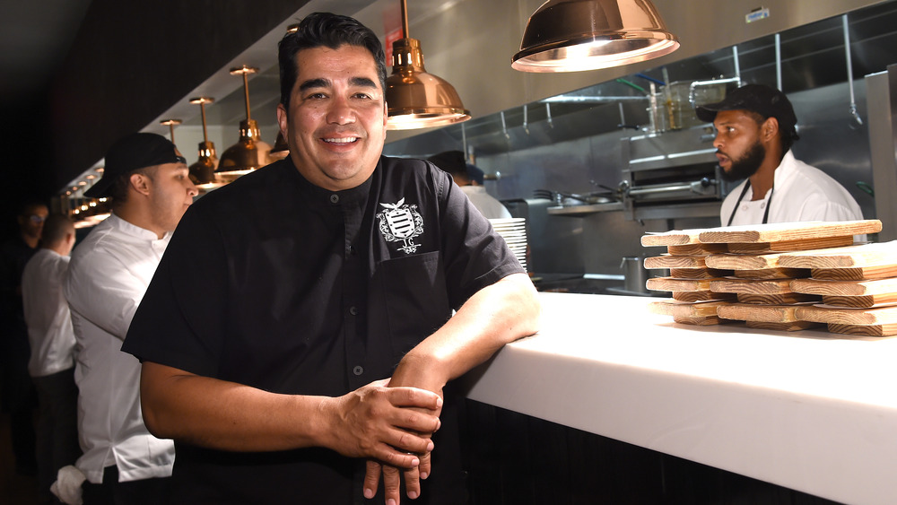 Jose Garces dressed in black