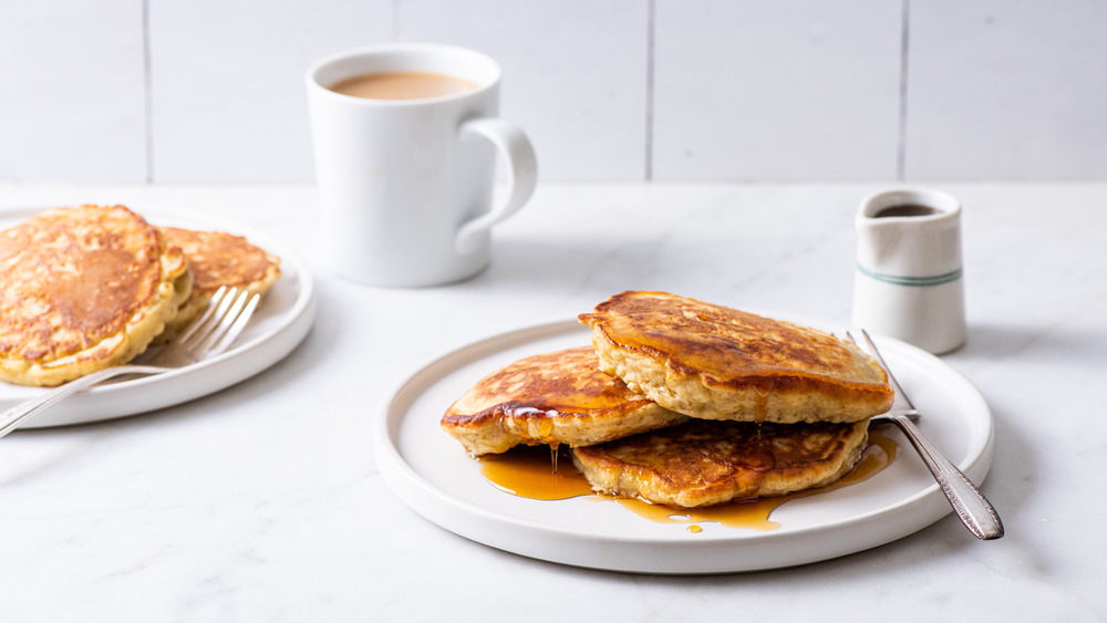 Oatmeal pancakes drizzled with maple syrup