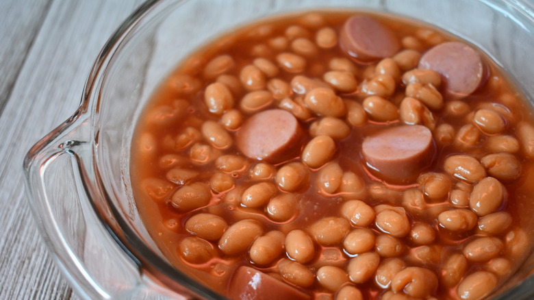 glass dish of hot dogs and beans