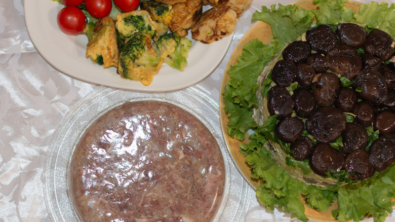 Jellied meat and other foods on platters