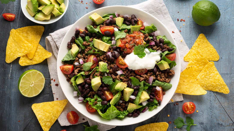 Beef taco salad in a white ceramic bowl
