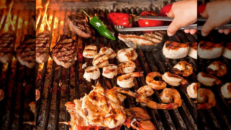 Various meat and seafood on charcoal grill