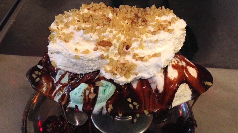 Ice cream sundae with hot fudge, whipped cream, and nuts