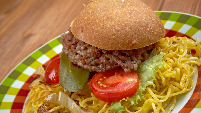 Chow mein sandwich with meat and burger bun