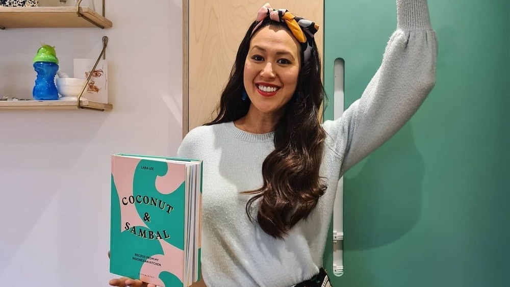 Lara Lee holding her book Coconut&Sambal