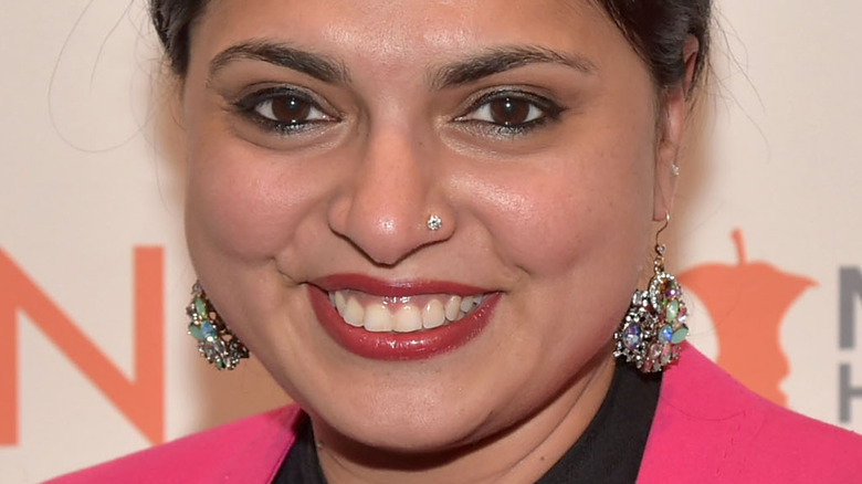 Maneet Chauhan wearing pink jacket and smiling