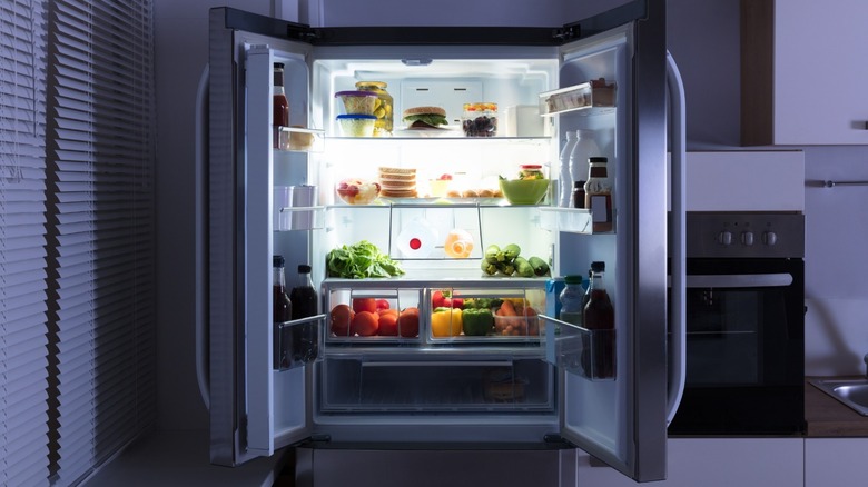 Open fridge at night 