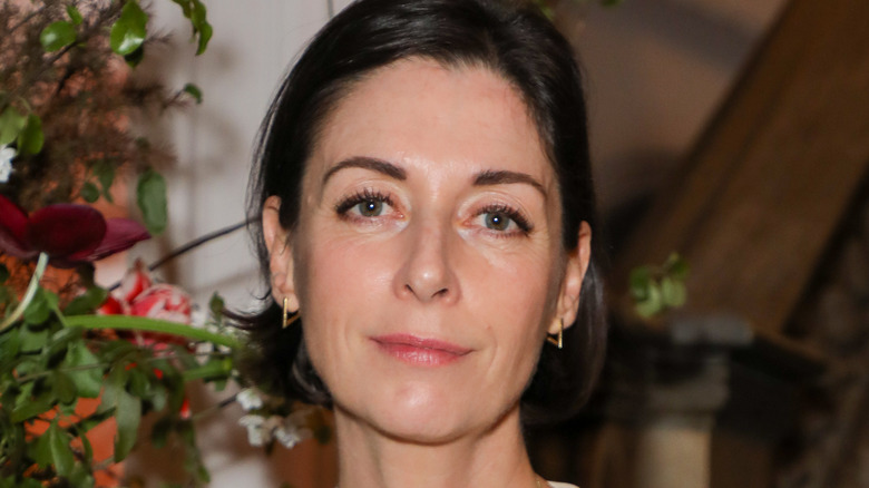 Mary McCartney standing near flowers