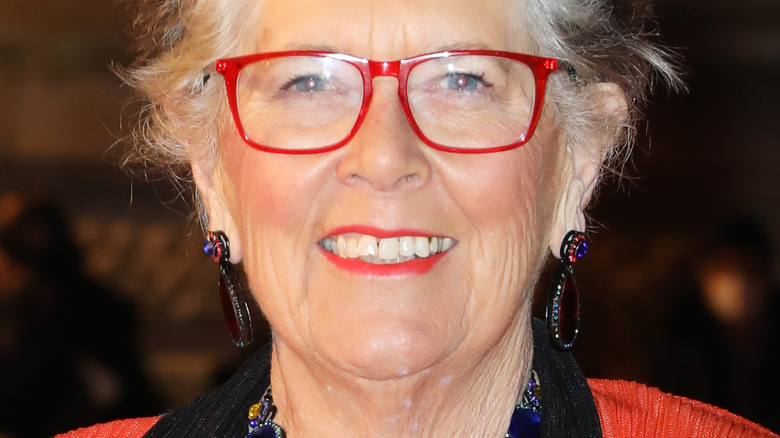 Prue Leith with red glasses and wide smile