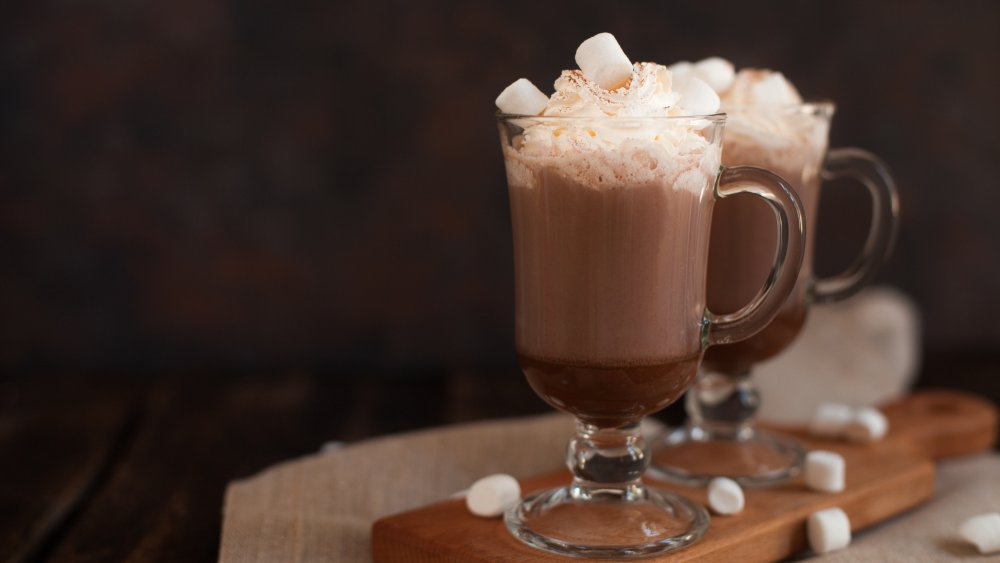 Hot chocolate topped with whipped cream and marshmallows