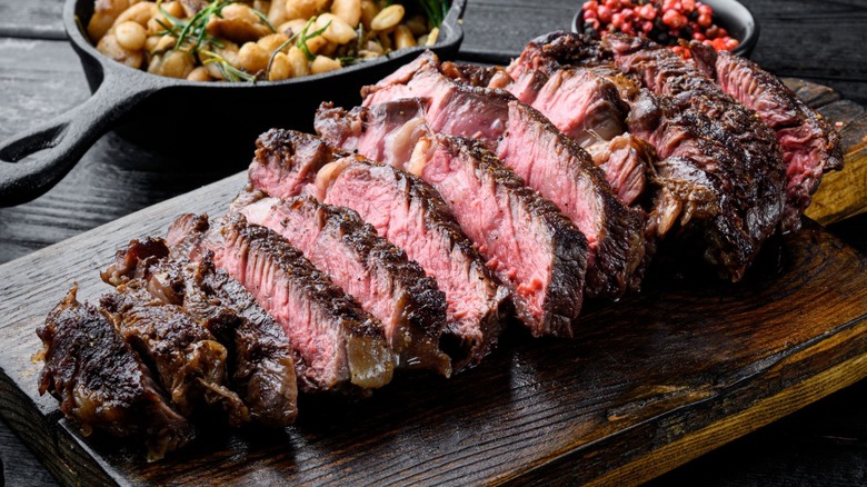 sliced steak on a cutting board