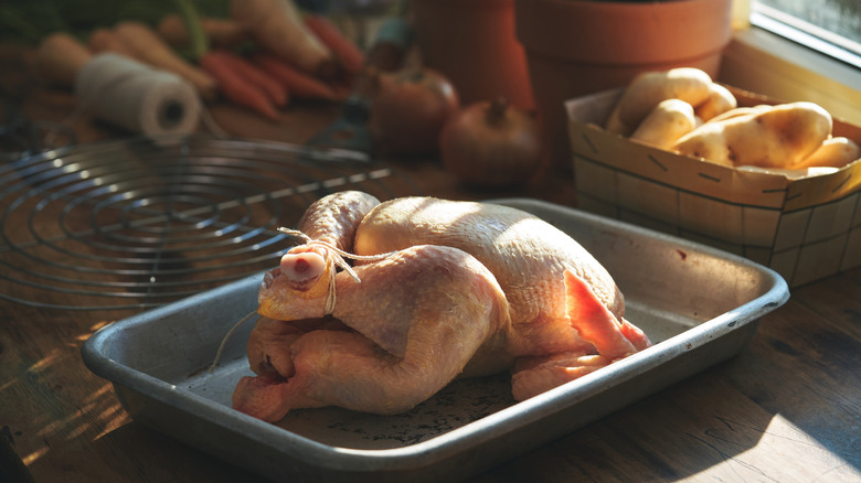 Whole chicken in a baking pan