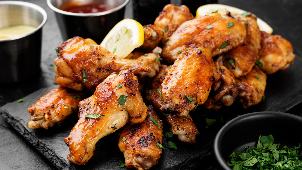 Chicken wings on a stone platter