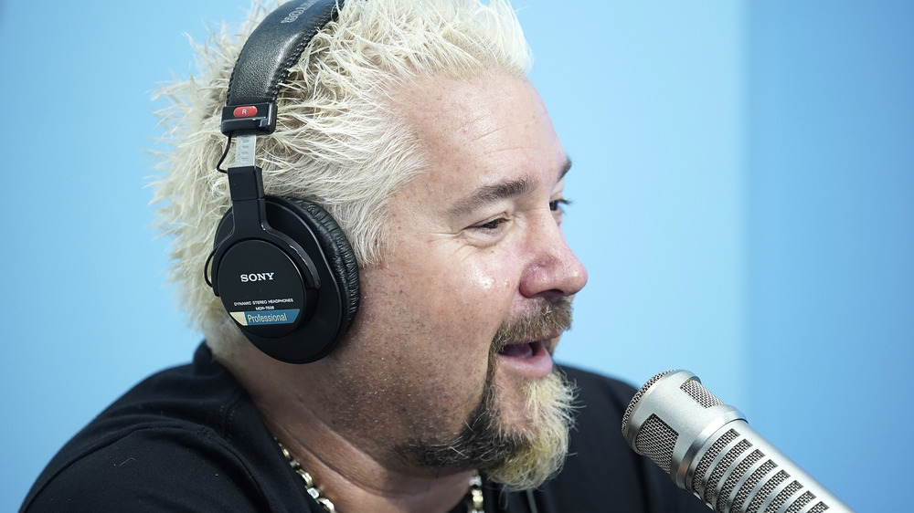 Guy Fieri with headphones on