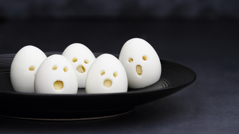 Boiled eggs with scary faces 