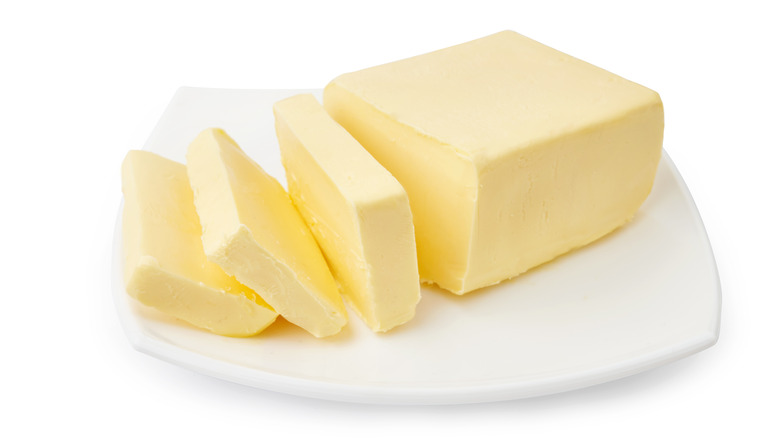 slices of butter on a serving dish