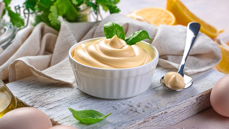 ramekin of mayo on board with spoon