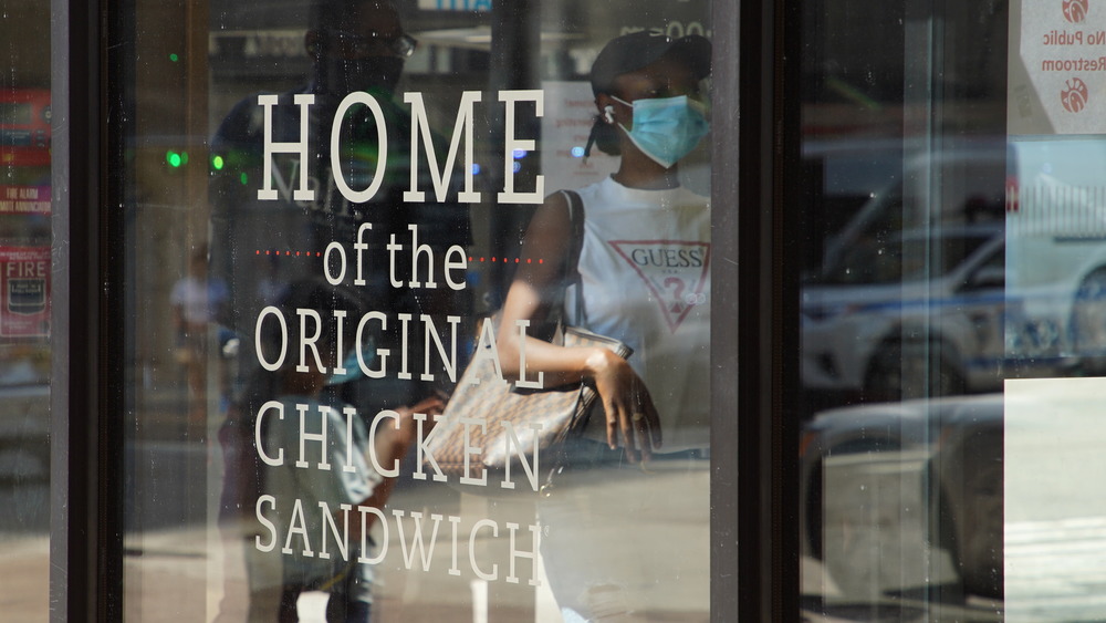 A sign saying "Home of the Original Chicken Sandwich." Is that true? Did no one ever think to slab a flayed chick between breads?