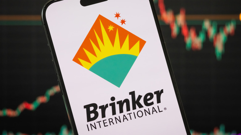 A mobile phone showing the logo of Brinker International, Inc.