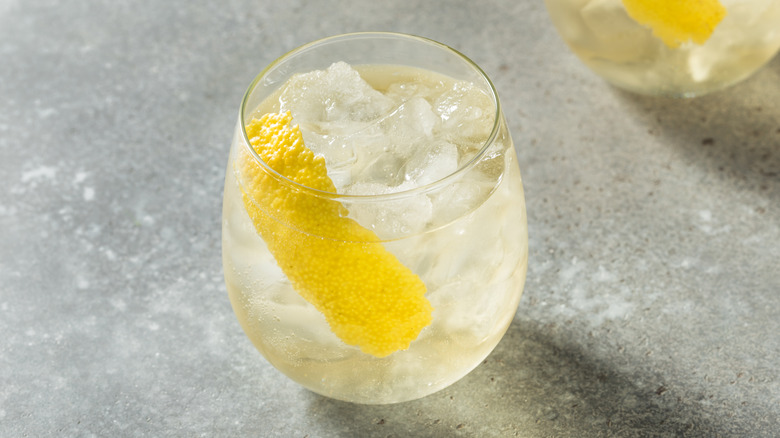 White wine spritz with lemon peel in glass