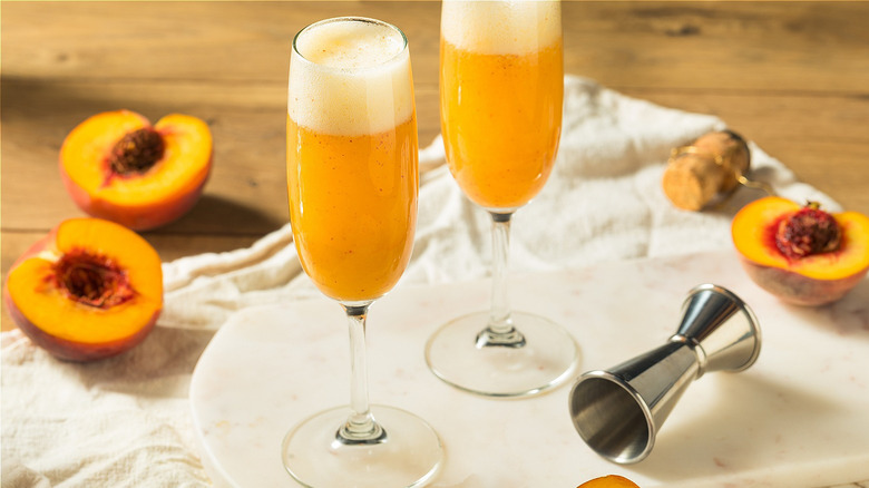 Bellini in champagne flute  with peach halves
