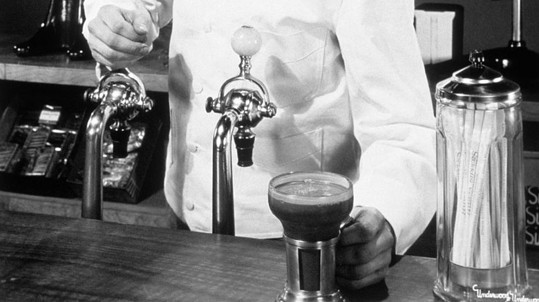 Soda jerk making milkshake
