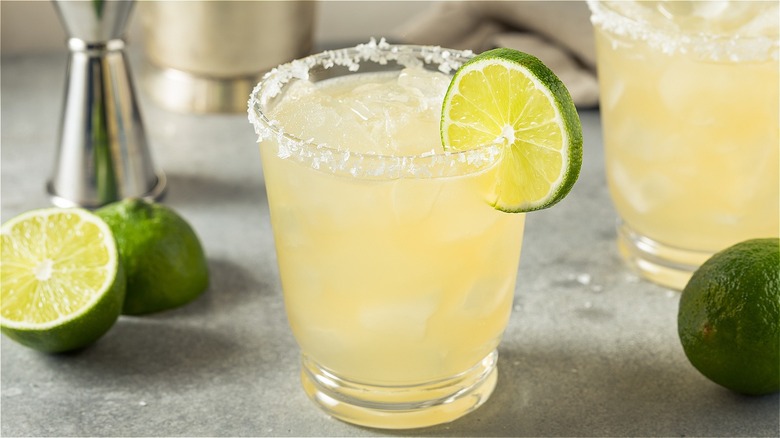 Margarita on the rocks with salted rim and lime garnish