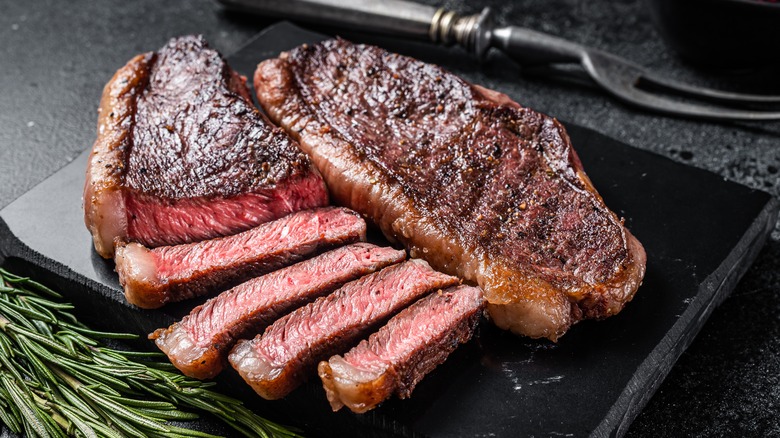 grilled steak on cutting board