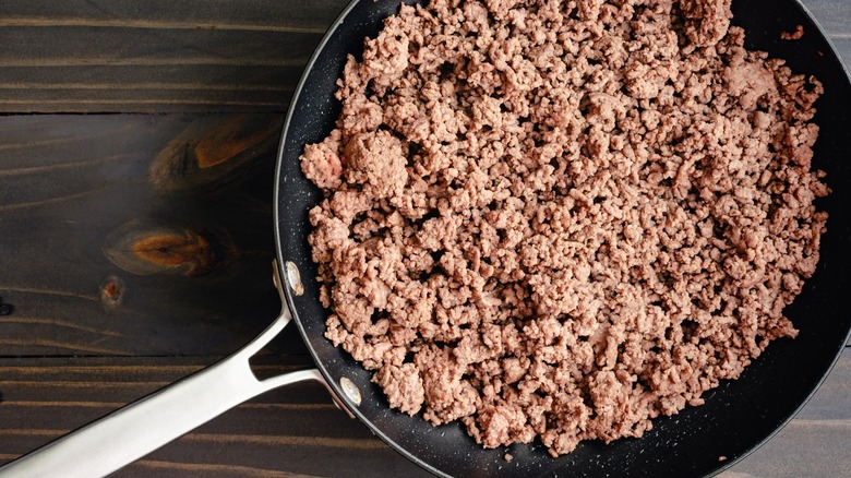Ground beef cooking in a pan