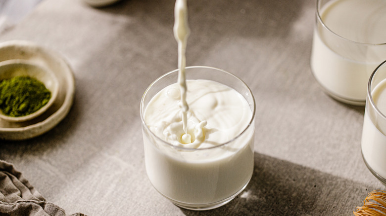 milk pouring in glass