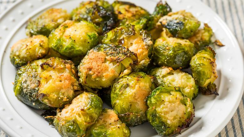 A plate of crispy, seasoned Brussels sprouts.