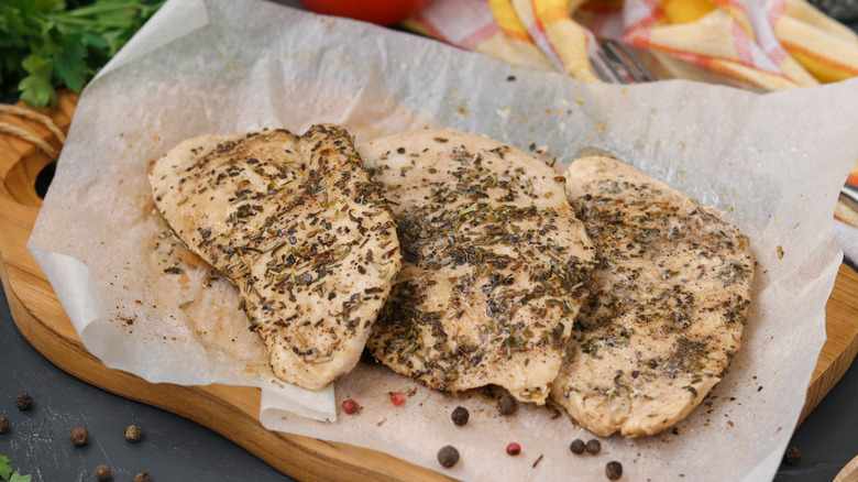chicken breast on parchment paper