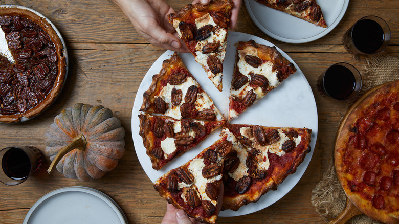 Pecan pie pizza being pulled apart