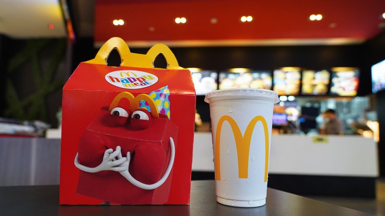 McDonald's Happy Meal and drink on McDonald's counter