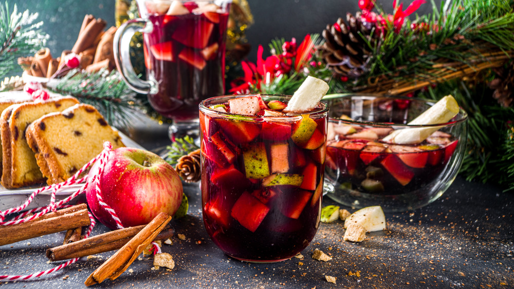 Christmas punch in glasses with ingredients