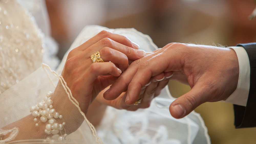 Bride and groom exchange rings