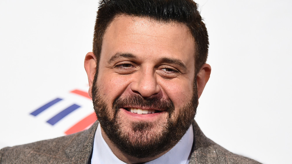 Food TV personality Adam Richman in a suit