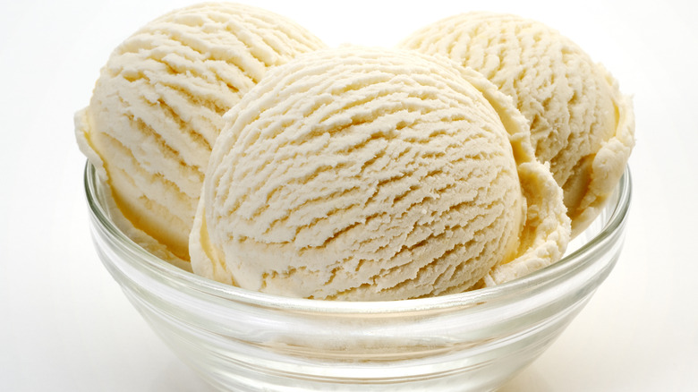 bowl with three scoops of vanilla ice cream