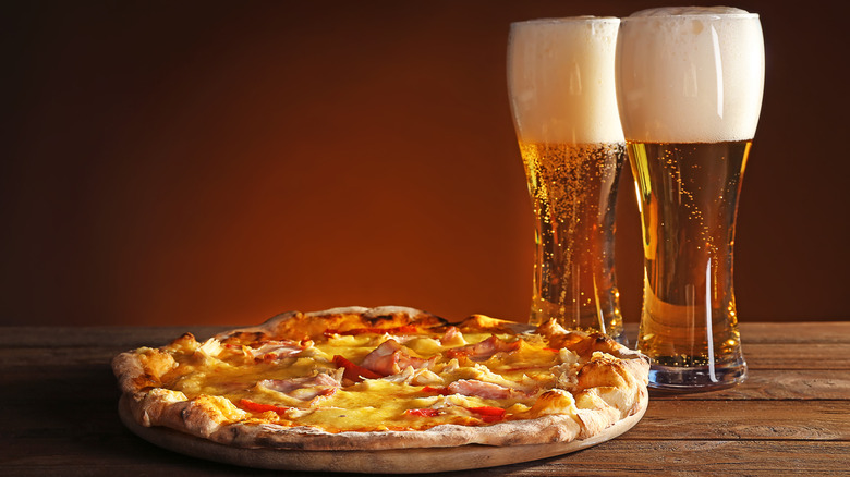 Pizza with two glasses of beer