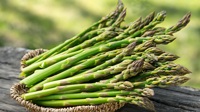 Asparagus in brown wicker basket