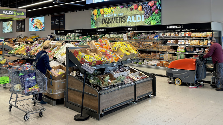 People shopping in Aldi produce section