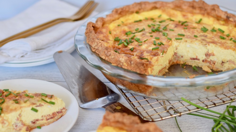 quiche lorraine with a slice taken out