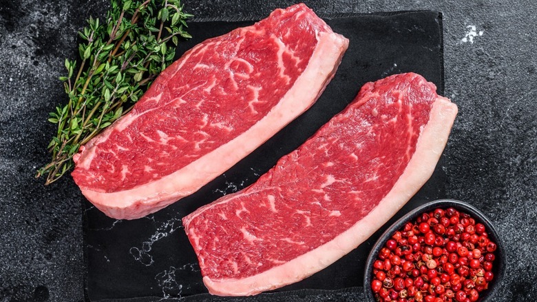 A pair of raw steaks 
