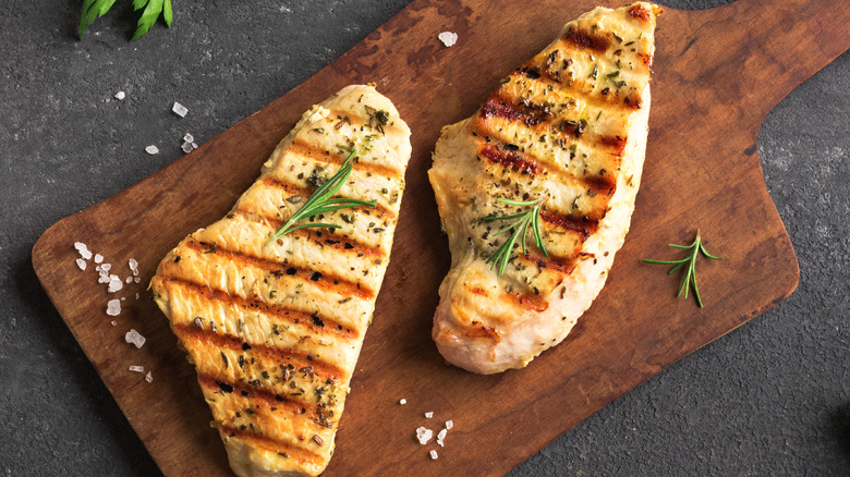 Grilled chicken on cutting board