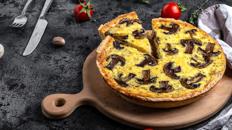 Mushroom quiche on a wooden board