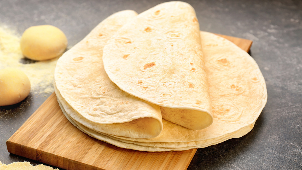 Flour tortillas on a wood cutting board