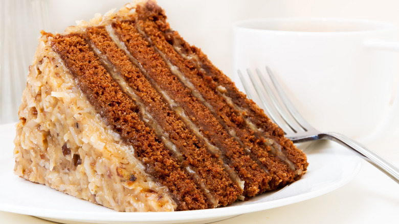 Slice of German chocolate cake next to fork